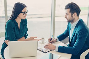 Business owner talking to insurance agent