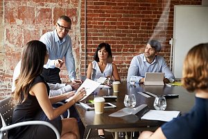 Employee meeting at conference table 