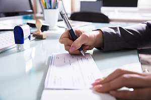 Employee paying workers compensation check