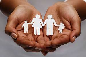 Hand holding family cutout - individual life insurance