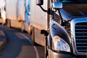 Row of trucks with trucking insurance