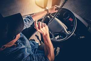 Trucker driving with trucking insurance