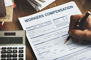 a small business owner applying for workers compensation insurance for his employees