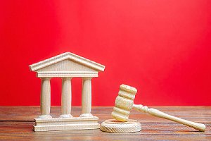Courthouse and gavel depicting lawmakers. Lawmakers first introduced ERISA to streamline employee pensions