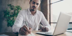 Employee researching cyber liability insurance