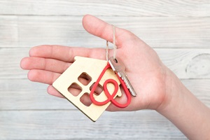 key to the apartment or house with the key pendant in the form of the logo