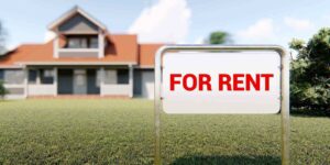 sign for rent and house in background