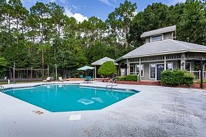 community clubhouse with an outdoor pool