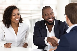 couple talking to their HOA insurance agent