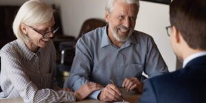 mature family couple of clients consulting legal expert
