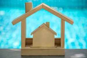 model wooden house at swimming pool