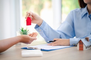 broker giving keys of new house