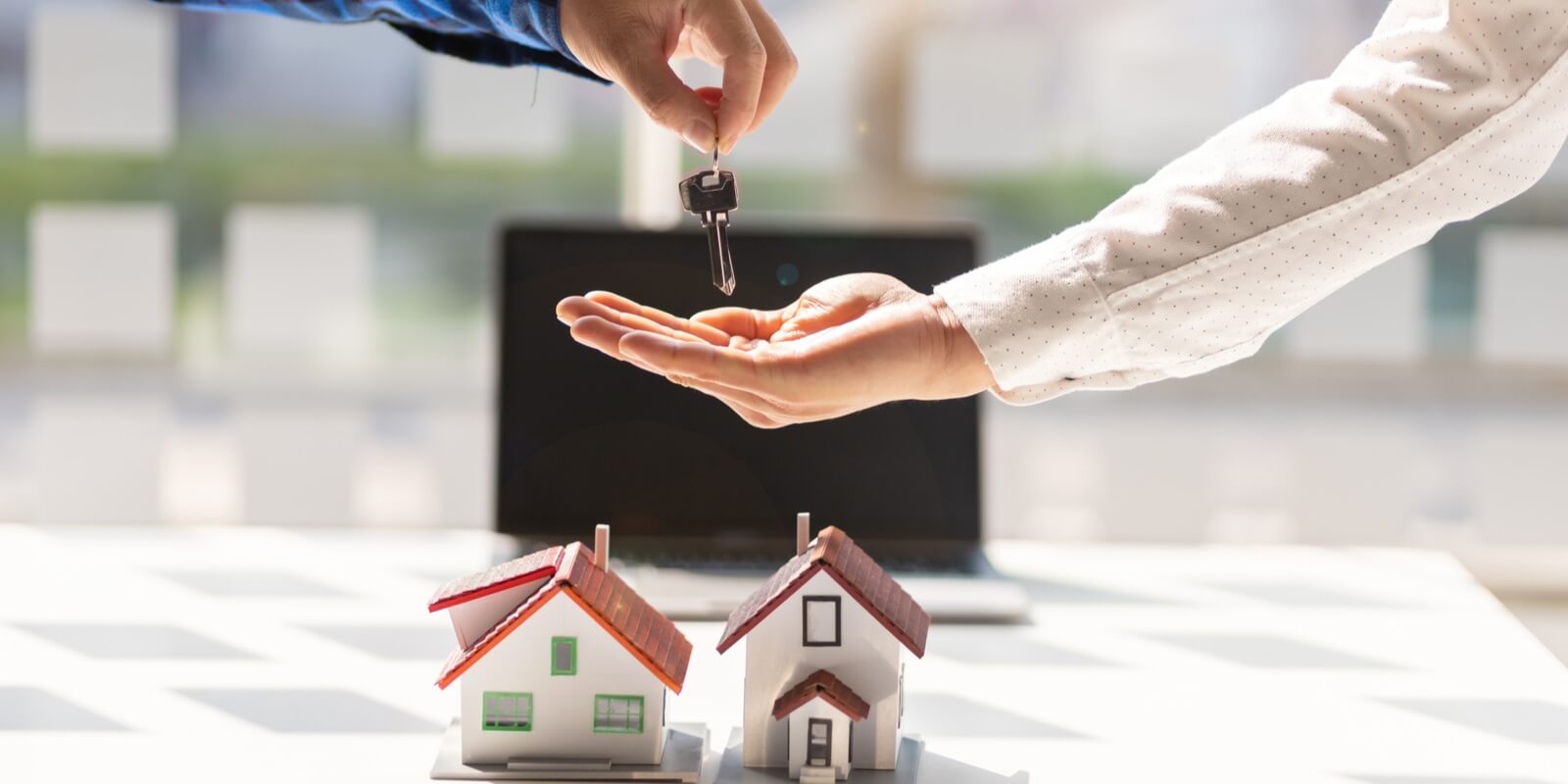 Do I Need Landlord Insurance For Short Term Rental   Real Estate Agent Hands The Customer The Keys To The House After The Contract Agreement Is Complete 