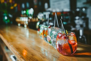 alcoholic cocktail row on bar table