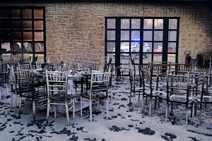 view of burnt out restaurant as a wildfire continues to rage at Varympompi suburb north of Athens in Greece