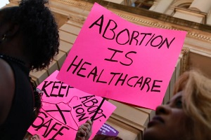 abortion is healthcare in pink paper