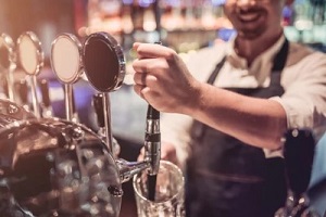 bar worker with machine