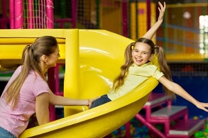 mother daughter playing in familiy entertainment center