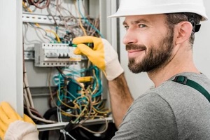 smiling electrician on work