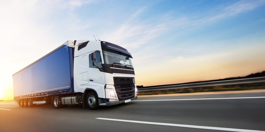 loaded european truck on motorway in sunset