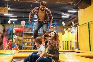 family enjoying in fun center