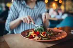 girl eating in a restaurant