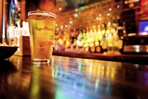 glass of beer on the table in a bar