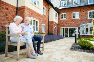 Insurance Solutions for Senior Living Facilities for couple outside