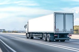 cargo truck with a white blank empty trailer on highway road