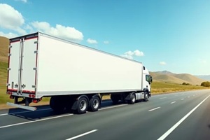 white truck on a wide U.S. highway with blank trailer ready for branding or text