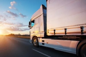 loaded european truck on motorway in sunset