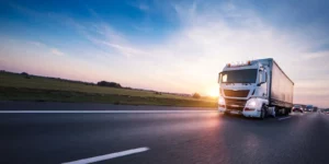 loaded european truck on motorway in sunset