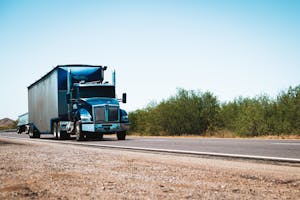 A Truck Going on Road