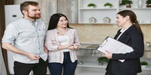 Home Insurance Agent Talking to Her Clients about investment property insurance