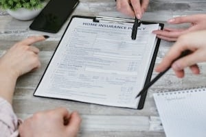 Homeowners Discussing Insurance Quotes with Agent