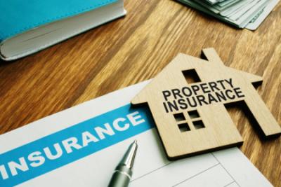 Renters insurance form with a wooden house icon on a desk