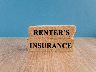 Wooden blocks displaying Renter’s Insurance on a table