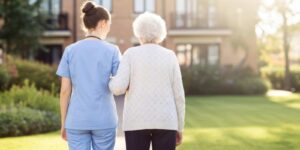 Senior Woman Enjoying Outdoors with Assisted Living Caregiver