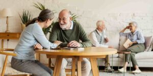 Elderly People in Assisted Living Facility Talking to Each Other